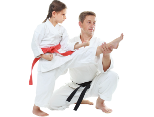 instructor teaching girl martial arts